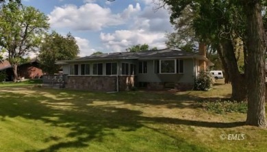 Nestled in the Country Club Estates, this charming ranch-style on Miles City Town and Country Club in Montana - for sale on GolfHomes.com, golf home, golf lot