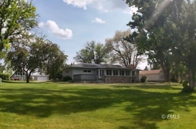 Nestled in the Country Club Estates, this charming ranch-style on Miles City Town and Country Club in Montana - for sale on GolfHomes.com, golf home, golf lot