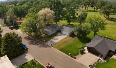 Nestled in the Country Club Estates, this charming ranch-style on Miles City Town and Country Club in Montana - for sale on GolfHomes.com, golf home, golf lot