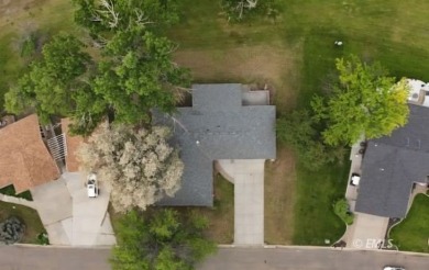 Nestled in the Country Club Estates, this charming ranch-style on Miles City Town and Country Club in Montana - for sale on GolfHomes.com, golf home, golf lot