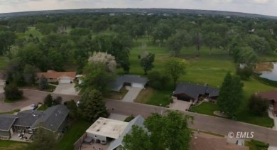 Nestled in the Country Club Estates, this charming ranch-style on Miles City Town and Country Club in Montana - for sale on GolfHomes.com, golf home, golf lot
