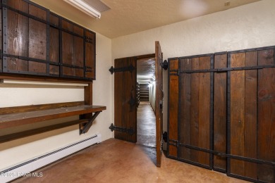 Discover a rare fusion of old-world elegance & cutting-edge on StoneRidge Golf Course in Arizona - for sale on GolfHomes.com, golf home, golf lot
