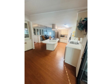 Welcome to this spacious 2-bedroom, 2-bath home located gated on Lake Fairways Country Club in Florida - for sale on GolfHomes.com, golf home, golf lot