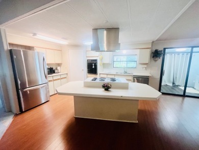 Welcome to this spacious 2-bedroom, 2-bath home located gated on Lake Fairways Country Club in Florida - for sale on GolfHomes.com, golf home, golf lot