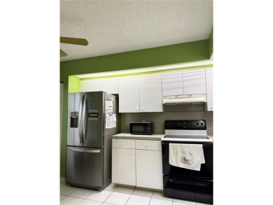 Welcome to 1001 SW 128 Ter #B407! This bright, spacious condo on Flamingo Lakes Country Club in Florida - for sale on GolfHomes.com, golf home, golf lot