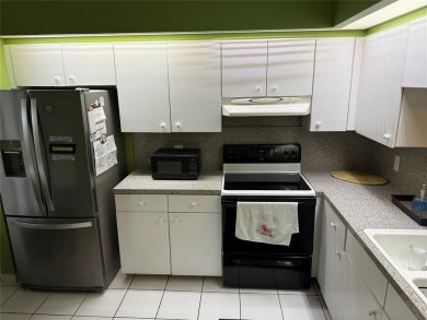 Welcome to 1001 SW 128 Ter #B407! This bright, spacious condo on Flamingo Lakes Country Club in Florida - for sale on GolfHomes.com, golf home, golf lot