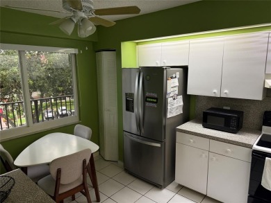 Welcome to 1001 SW 128 Ter #B407! This bright, spacious condo on Flamingo Lakes Country Club in Florida - for sale on GolfHomes.com, golf home, golf lot