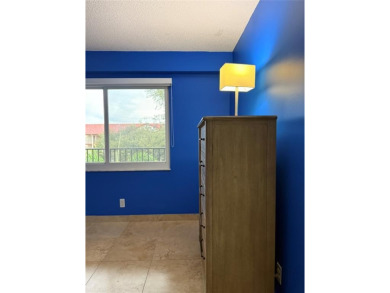 Welcome to 1001 SW 128 Ter #B407! This bright, spacious condo on Flamingo Lakes Country Club in Florida - for sale on GolfHomes.com, golf home, golf lot