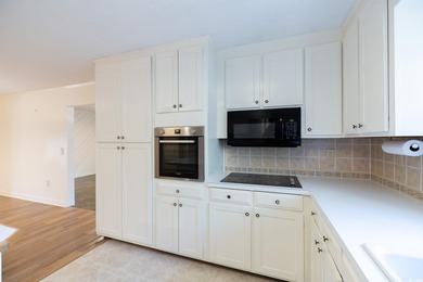 Set on a generous lot with wooded surroundings and views of the on The Founders Club At Pawleys Island in South Carolina - for sale on GolfHomes.com, golf home, golf lot