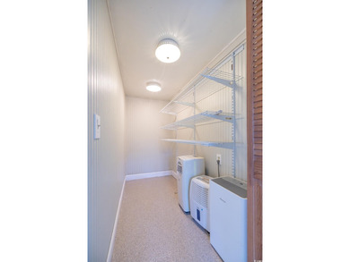 Set on a generous lot with wooded surroundings and views of the on The Founders Club At Pawleys Island in South Carolina - for sale on GolfHomes.com, golf home, golf lot