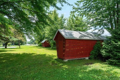 Discover the timeless charm of 9980 Tittabawassee, a historic on Golf Club At Apple Mountain in Michigan - for sale on GolfHomes.com, golf home, golf lot