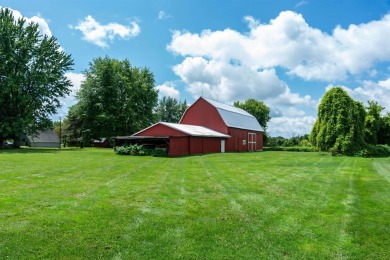 Discover the timeless charm of 9980 Tittabawassee, a historic on Golf Club At Apple Mountain in Michigan - for sale on GolfHomes.com, golf home, golf lot