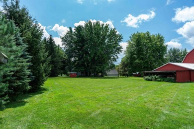 Discover the timeless charm of 9980 Tittabawassee, a historic on Golf Club At Apple Mountain in Michigan - for sale on GolfHomes.com, golf home, golf lot