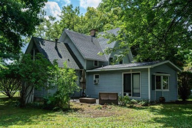 Discover the timeless charm of 9980 Tittabawassee, a historic on Golf Club At Apple Mountain in Michigan - for sale on GolfHomes.com, golf home, golf lot