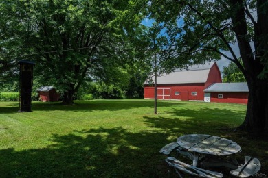 Discover the timeless charm of 9980 Tittabawassee, a historic on Golf Club At Apple Mountain in Michigan - for sale on GolfHomes.com, golf home, golf lot