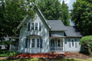 Discover the timeless charm of 9980 Tittabawassee, a historic on Golf Club At Apple Mountain in Michigan - for sale on GolfHomes.com, golf home, golf lot