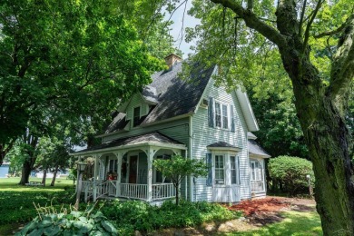 Discover the timeless charm of 9980 Tittabawassee, a historic on Golf Club At Apple Mountain in Michigan - for sale on GolfHomes.com, golf home, golf lot