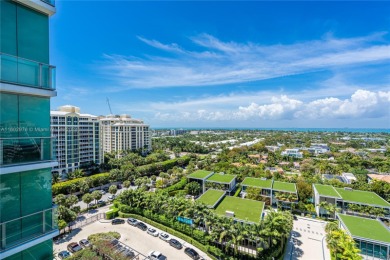 Gorgeous finely finished flow-through unit at the exclusive on Crandon Golf At Key Biscayne in Florida - for sale on GolfHomes.com, golf home, golf lot