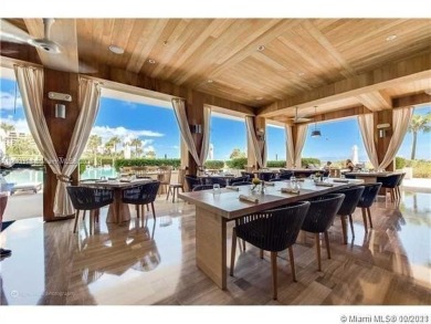 Gorgeous finely finished flow-through unit at the exclusive on Crandon Golf At Key Biscayne in Florida - for sale on GolfHomes.com, golf home, golf lot