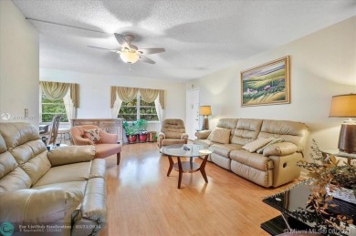 THIS 55+ 3RD FLOOR CORNER UNIT IN CENTURY VILLAGE HAS LAKE AND on Grand Palms Hotel and Golf Resort in Florida - for sale on GolfHomes.com, golf home, golf lot