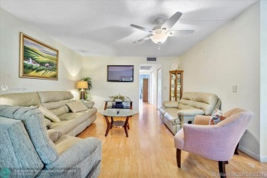 THIS 55+ 3RD FLOOR CORNER UNIT IN CENTURY VILLAGE HAS LAKE AND on Grand Palms Hotel and Golf Resort in Florida - for sale on GolfHomes.com, golf home, golf lot