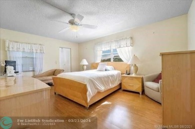 THIS 55+ 3RD FLOOR CORNER UNIT IN CENTURY VILLAGE HAS LAKE AND on Grand Palms Hotel and Golf Resort in Florida - for sale on GolfHomes.com, golf home, golf lot