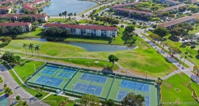 THIS 55+ 3RD FLOOR CORNER UNIT IN CENTURY VILLAGE HAS LAKE AND on Grand Palms Hotel and Golf Resort in Florida - for sale on GolfHomes.com, golf home, golf lot