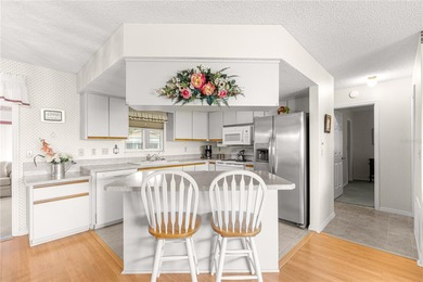 Welcome home to this immaculately maintained and sparkling clean on The Links of Spruce Creek in Florida - for sale on GolfHomes.com, golf home, golf lot