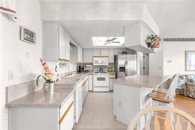 Welcome home to this immaculately maintained and sparkling clean on The Links of Spruce Creek in Florida - for sale on GolfHomes.com, golf home, golf lot