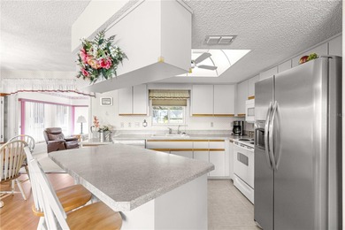 Welcome home to this immaculately maintained and sparkling clean on The Links of Spruce Creek in Florida - for sale on GolfHomes.com, golf home, golf lot