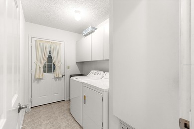 Welcome home to this immaculately maintained and sparkling clean on The Links of Spruce Creek in Florida - for sale on GolfHomes.com, golf home, golf lot