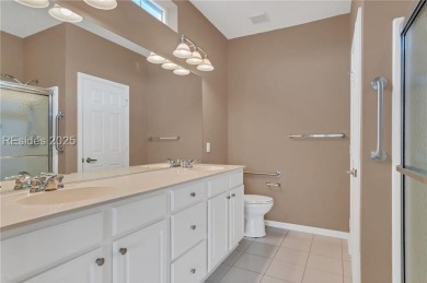 Enjoy Fabulous lagoon views from your large covered screen on Hidden Cypress Golf Club in South Carolina - for sale on GolfHomes.com, golf home, golf lot