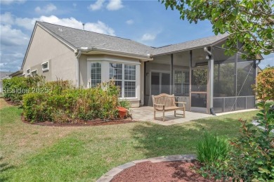 Enjoy Fabulous lagoon views from your large covered screen on Hidden Cypress Golf Club in South Carolina - for sale on GolfHomes.com, golf home, golf lot