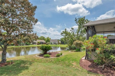 Enjoy Fabulous lagoon views from your large covered screen on Hidden Cypress Golf Club in South Carolina - for sale on GolfHomes.com, golf home, golf lot