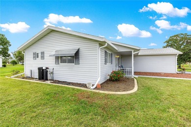 Welcome home to this immaculately maintained and sparkling clean on The Links of Spruce Creek in Florida - for sale on GolfHomes.com, golf home, golf lot