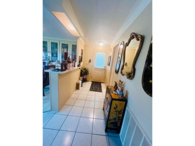 If you're looking for a large 2-bedroom, 2-bath home with a on Lake Fairways Country Club in Florida - for sale on GolfHomes.com, golf home, golf lot