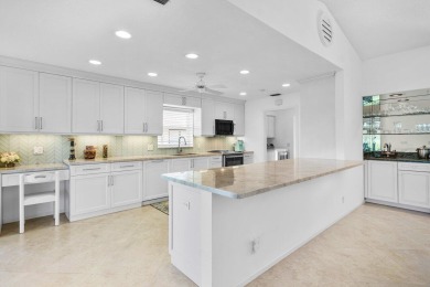 Sweeping golf course and lake views of the newly redesigned on Quail Ridge Golf Course and Country Club in Florida - for sale on GolfHomes.com, golf home, golf lot