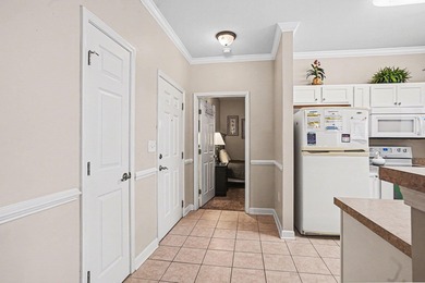 This first-floor end unit condominium features three bedrooms on Barefoot Resort and Golf Club  in South Carolina - for sale on GolfHomes.com, golf home, golf lot
