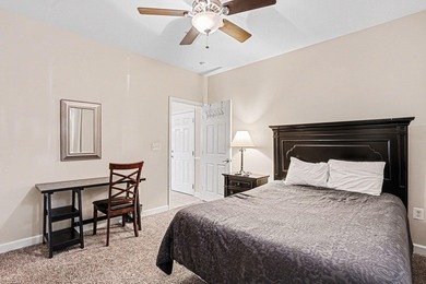 This first-floor end unit condominium features three bedrooms on Barefoot Resort and Golf Club  in South Carolina - for sale on GolfHomes.com, golf home, golf lot