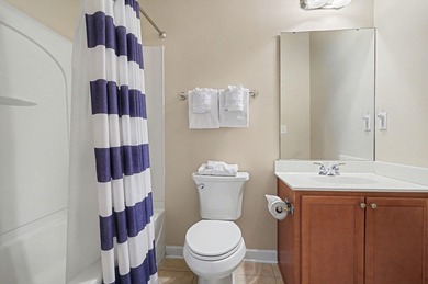 This first-floor end unit condominium features three bedrooms on Barefoot Resort and Golf Club  in South Carolina - for sale on GolfHomes.com, golf home, golf lot