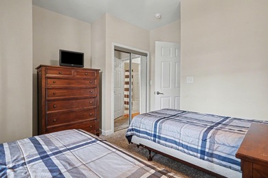 This first-floor end unit condominium features three bedrooms on Barefoot Resort and Golf Club  in South Carolina - for sale on GolfHomes.com, golf home, golf lot