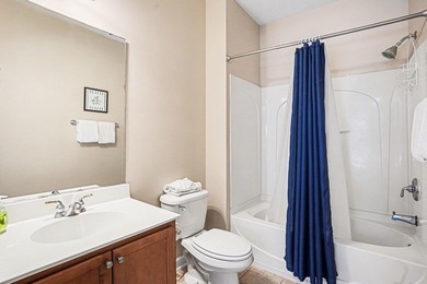 This first-floor end unit condominium features three bedrooms on Barefoot Resort and Golf Club  in South Carolina - for sale on GolfHomes.com, golf home, golf lot