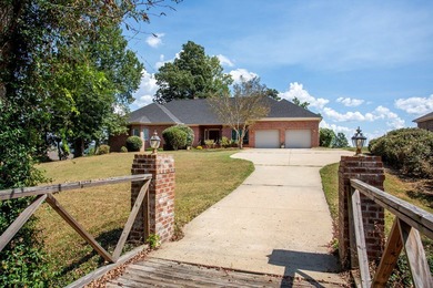 Welcome to a truly exceptional waterfront retreat on the coveted on Red Eagle Golf Course in Alabama - for sale on GolfHomes.com, golf home, golf lot