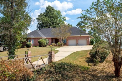 Welcome to a truly exceptional waterfront retreat on the coveted on Red Eagle Golf Course in Alabama - for sale on GolfHomes.com, golf home, golf lot