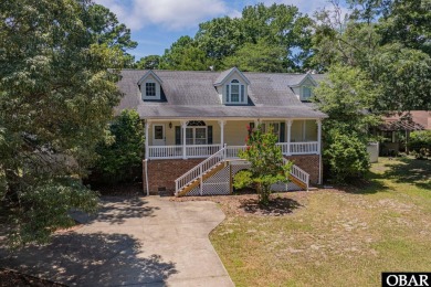 Welcome to your dream home, perfectly positioned in the heart of on Duck Woods Country Club in North Carolina - for sale on GolfHomes.com, golf home, golf lot