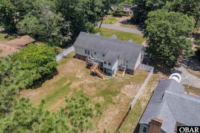 Welcome to your dream home, perfectly positioned in the heart of on Duck Woods Country Club in North Carolina - for sale on GolfHomes.com, golf home, golf lot