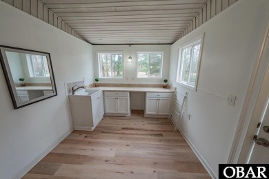 Welcome to your dream home, perfectly positioned in the heart of on Duck Woods Country Club in North Carolina - for sale on GolfHomes.com, golf home, golf lot