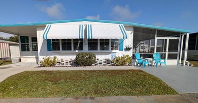 Turnkey Living! Expanded 2BR/2BA in Woodbrook Estates!  This on Grasslands Golf and Country Club in Florida - for sale on GolfHomes.com, golf home, golf lot