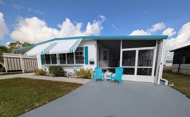 Turnkey Living! Expanded 2BR/2BA in Woodbrook Estates!  This on Grasslands Golf and Country Club in Florida - for sale on GolfHomes.com, golf home, golf lot