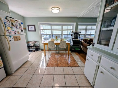 Turnkey Living! Expanded 2BR/2BA in Woodbrook Estates!  This on Grasslands Golf and Country Club in Florida - for sale on GolfHomes.com, golf home, golf lot